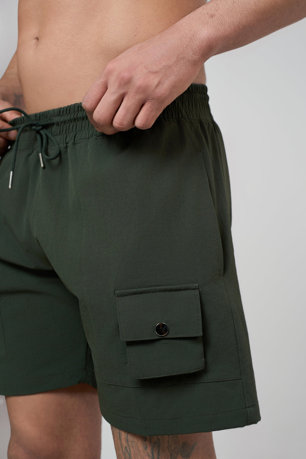 Green cargo shorts front view