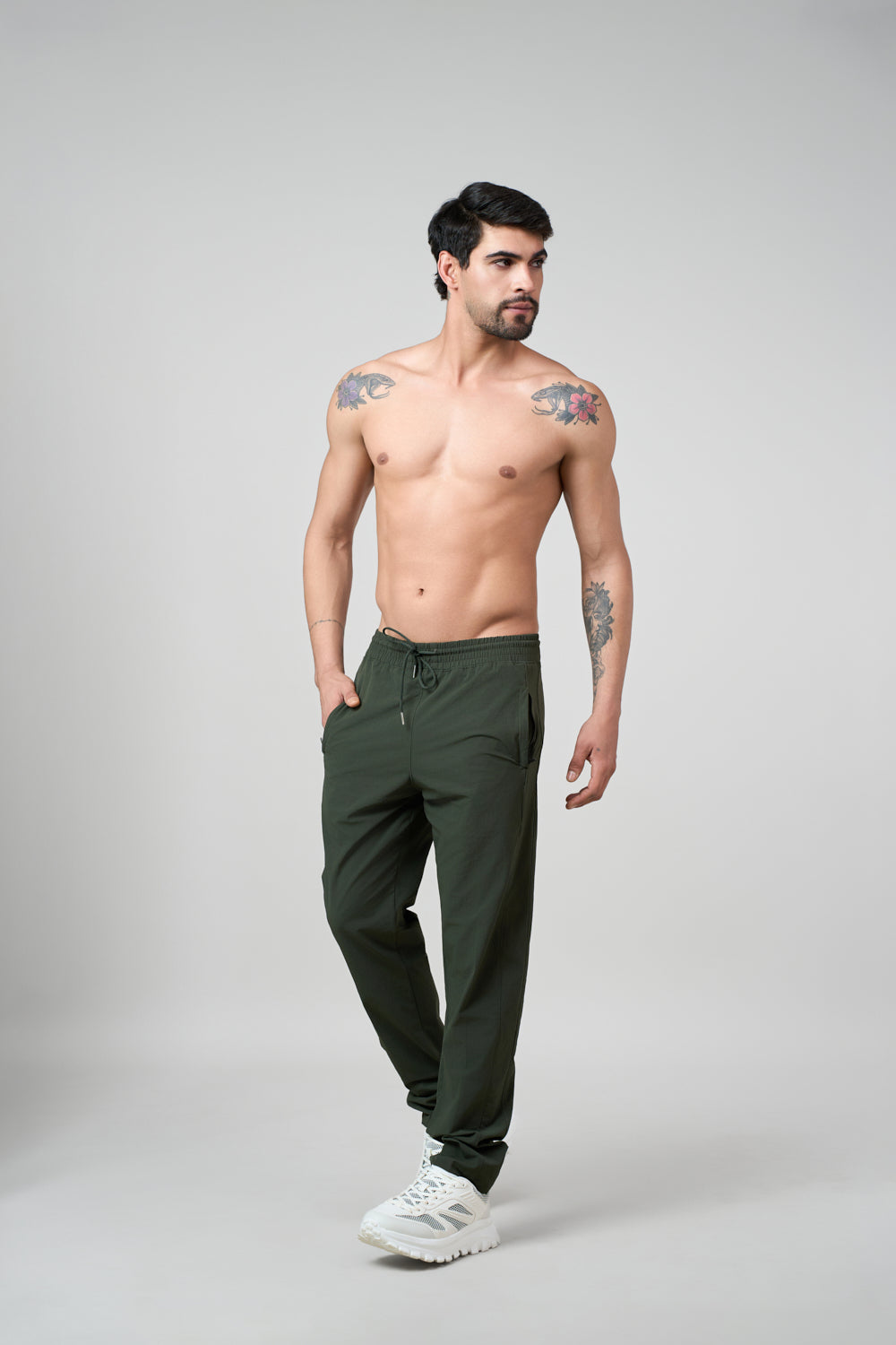 Green track pants front view